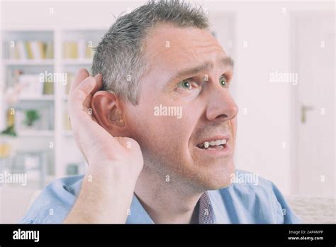 Man Wearing Hearing Aid Hi Res Stock Photography And Images Alamy