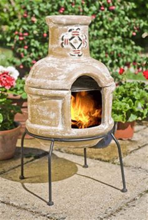 Portable barbecue fire pit with rotisserie. Pin by Home Decorating Ideas on Modern Chiminea for Outdoor | Outdoor fireplace designs, Clay ...