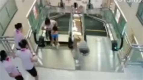 Chinese Woman Dies After Trapped In Escalator But Saves Son Today