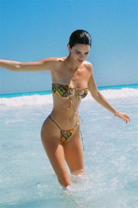 Kendall Jenner Stuns In Turquoise Thong Bikini As She Poses In Front Of