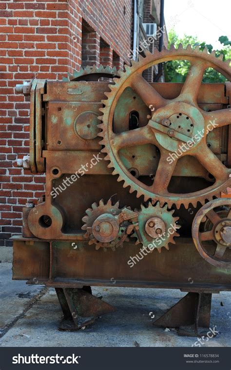 Old Rusty Gears Machinery Parts At Old Metal Factory Stock Photo