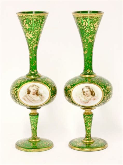 Two Green Glass Vases With Pictures On Them