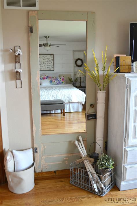 Learn how to decorate a mirrored wall for the 21st century with mirrored wall decals how to decorate a glass wall: Old Door Turned Full Length Mirror - Little Vintage Nest