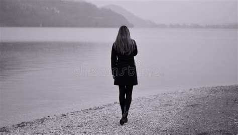 The Lonely Melancholy Woman On The Lake Shore Stock Photo Image Of