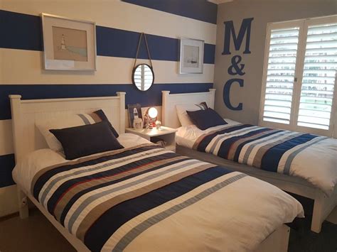 Whether you are just dreaming of that beach house getaway or you have a seaside cottage that needs the perfect nautical touch, we have the inside line on how to evoke the spirit of the sea in your home. Nautical Boys Bedroom | Home, Boys nautical bedroom, Home decor