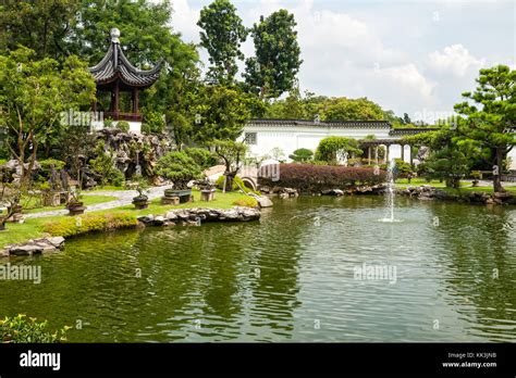 Pond With A Fountain And Goldfish In Chinese Garden Singapore Stock