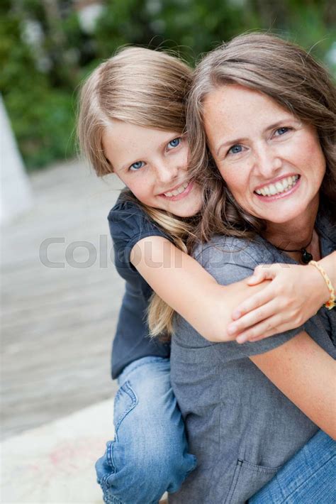 Daughter Hugging Mother Outside Stock Image Colourbox