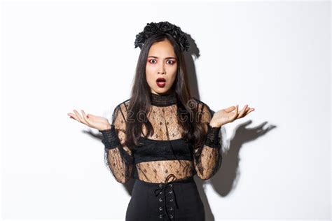 Confused Asian Woman In Halloween Costume Looking Clueless Raising