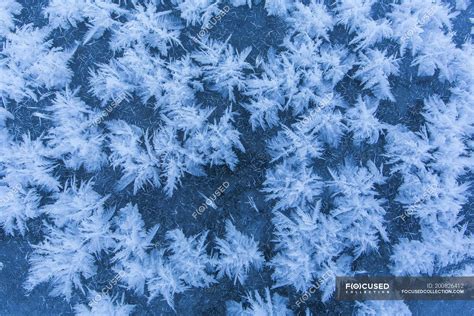 Ice Crystals Pattern On Ice Of Lake In Winter — Full Frame Wintertime