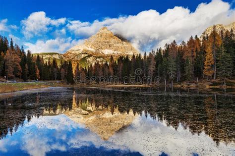 Lake Antorno In Dolomites And With Amazing Reflection Of Cloudy Sky And
