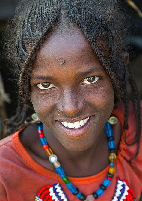 Portrait Of A Smiling Afar Tribe Girl With Braided Hair Afar Region