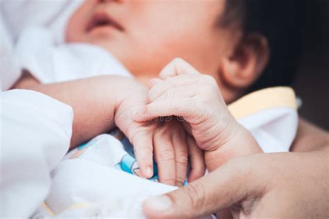 Newborn Baby Hands Holding Together While She Sleeping Stock Image