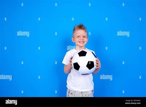 Soccer Fans Smiling Caucasian Child Boy Holding Soccer Ball In Hands