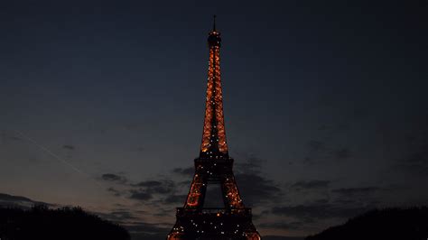 Paris Eiffel Tower With Red Lights With Background Of Dark Sky 4k Hd