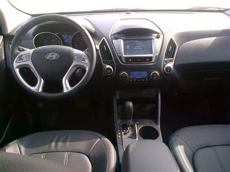 The 2014 hyundai tucson has an unusually stylish cabin, highlighted by a sleek dashboard that complements the exterior's striking lines. Road Test: 2014 Hyundai Tucson | Bahrain - YallaMotor