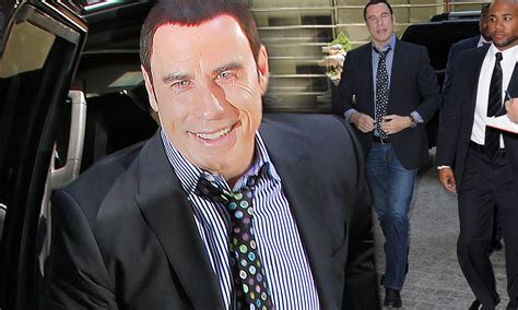 John Travolta Dons Toupee And Jokes With Fans Despite Being Enveloped In Sex Scandal
