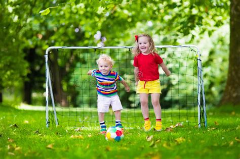Kids Playing Football In School Yard Stock Image Image Of Grass
