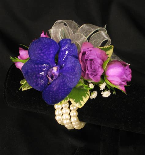 These have a tendency to droop, use floral wire to keep up. Lovely corsage created with lavender spray roses, babies ...