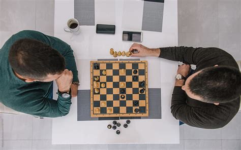 Friends Playing Chess High Angle View By Stocksy Contributor
