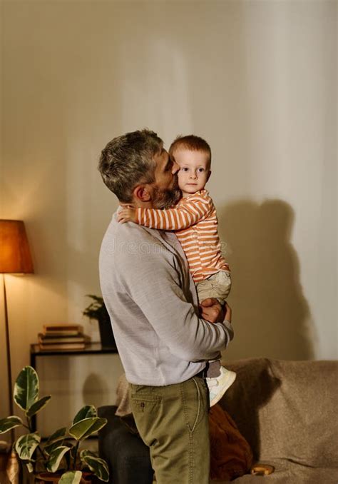 Father Kissing Sweet Baby Son On Cheek Stock Photo Image Of Mature
