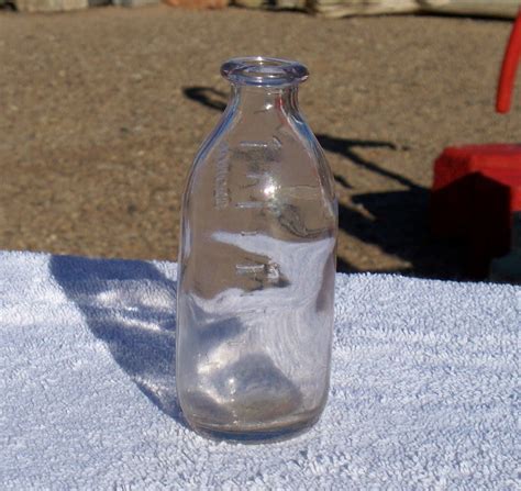 Small measuring bottle ounces marked K 5 on bottom maybe medicine? empty