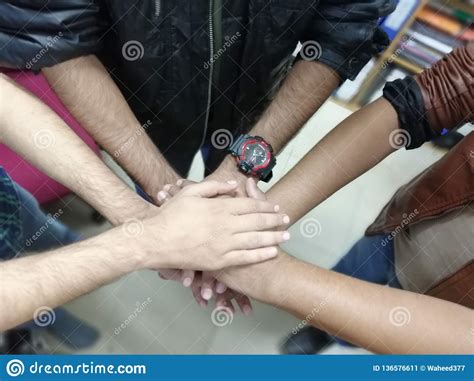 Close Up Top View Of Young People Putting Their Hands Together Friends