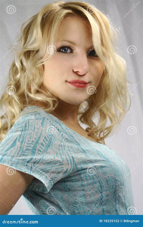 portrait of cute blonde teen girl on white background 058