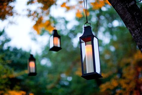 Hanging Lanterns In The Tree With Battery Powered Pillar Candles