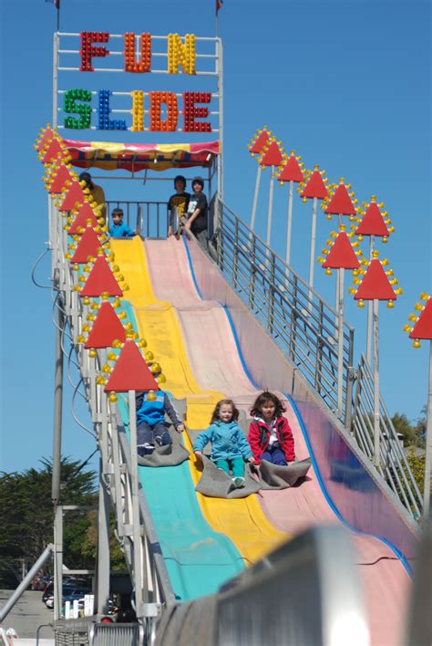 Kids Riding The Fun Slide At The Good Old Days Celebration And Music