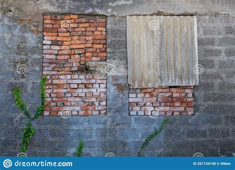 Boarded Up With Red Bricks Windows Of Broken Building Stock Photo