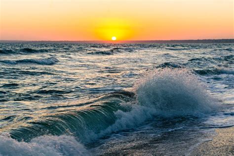 Sunrise On The Sea Of Azov Sun And Waves In The Morning Stock Photo