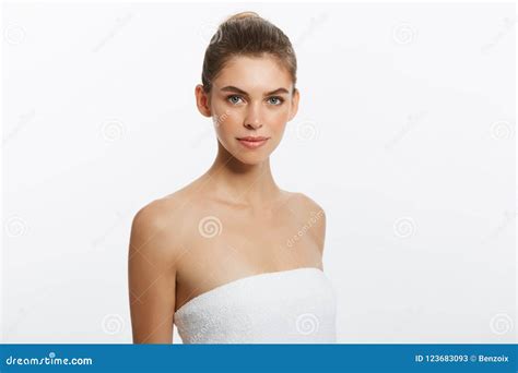 Beautiful Girl With Nude Make Up Posing At White Studio Background