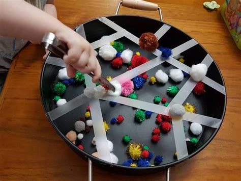 Sticky Tape And Pom Poms Fine Motor Skill Developing Activity In A