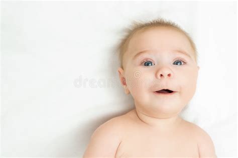 Beautiful Smiling Cute Baby Close Up Portrait Of A Happy Crawling Baby