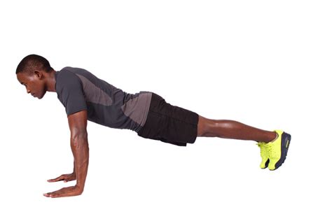 Black Man Doing Push Ups In Straight Arm Plank Position