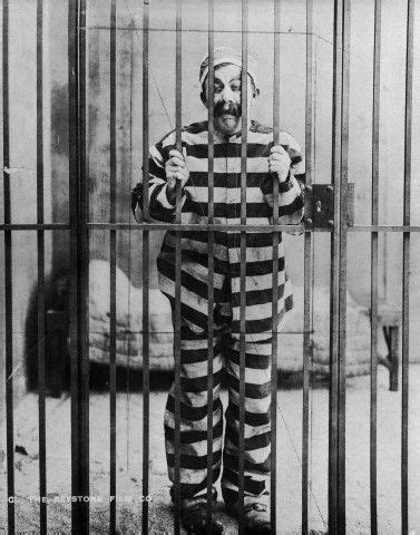 Chester Conklin Behind Bars In A Striped Prison Uniform In The