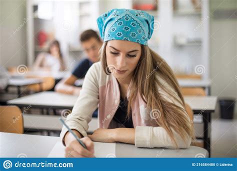 Teenagers Students Sitting In The Classroom Working Exam Stock Photo