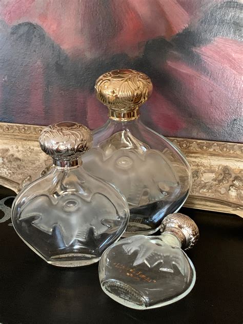 Three Graduating In Size Vintage Lalique Designed Perfume Bottles By