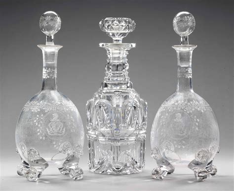 A Cut Glass Decanter And Stopper And A Pair Of Engraved Glass Crested Decanters And Stoppers