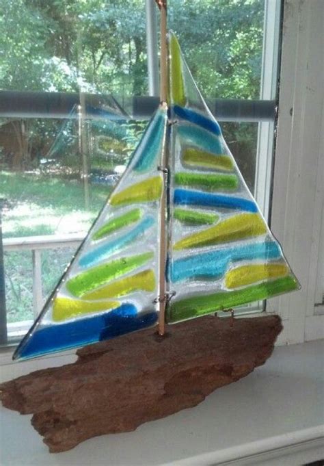 She combines her deep understanding of color with beautifully simple abstract designs to create a wide range of fused glass. Fused glass and driftwood sailboat #glassart #glass #art # ...