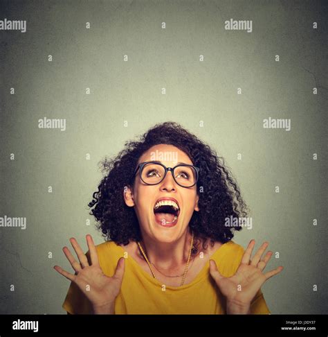 Super Excited Funky Girl Looking Up Isolated On Grey Wall Background