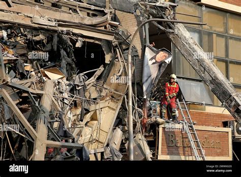 Iranian Firefighters Work At The Scene Of The Collapsed Plasco Building