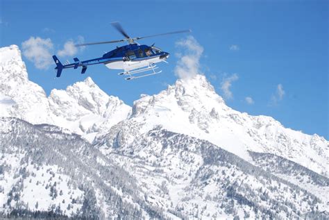 Helicopter Flying Over Snowy Mountain Web Hillsboro Aviation