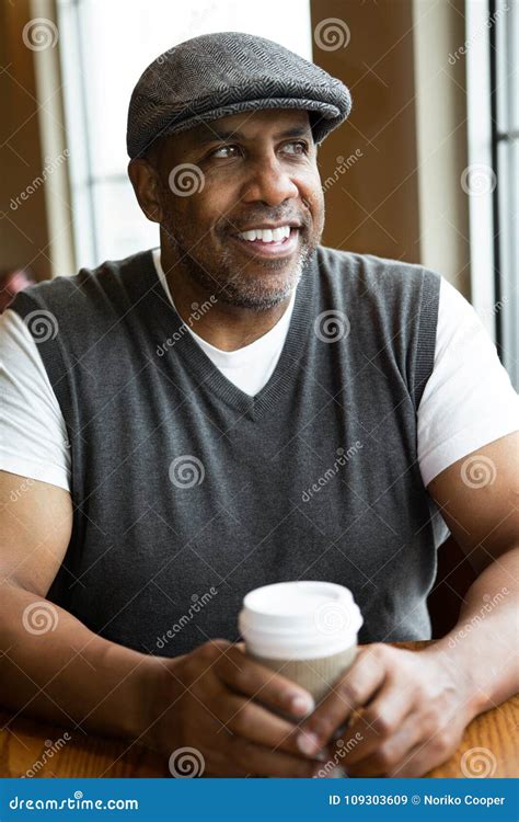 Mature African American Man Sitting In A Coffee Shop Stock Image