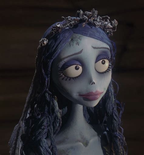 A Creepy Doll With Blue Hair And Makeup