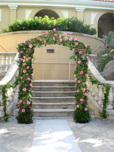 Garden Wedding Arch Covered With Ivy And Pink Roses Shades Of Pink