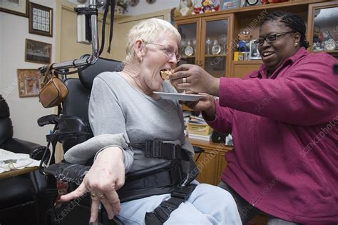 Woman With Cerebral Palsy Being Helped To Eat A Cake Stock Image C0465856 Science Photo