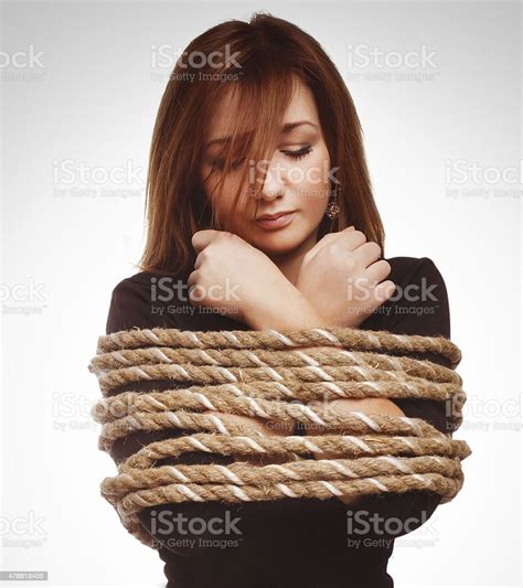 Brunette Hostage Captive Woman Bound With Rope Prisoner In Jean Stock