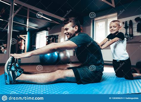 Father And Son Are Stretching Each Other In Gym Stock Image Image Of Father Caucasian 128309629