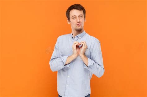 Funny Romantic Handsome Man Standing And Showing Heart Shape Gesture Falling In Love Stock